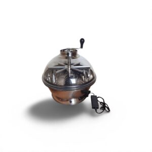Modern metal popcorn maker with transparent lid and black handle, showcasing an electric cord and foot pedal attachment.