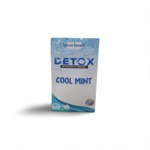 Detox activated charcoal cool mint package promoting freshness and fast action on a white background.